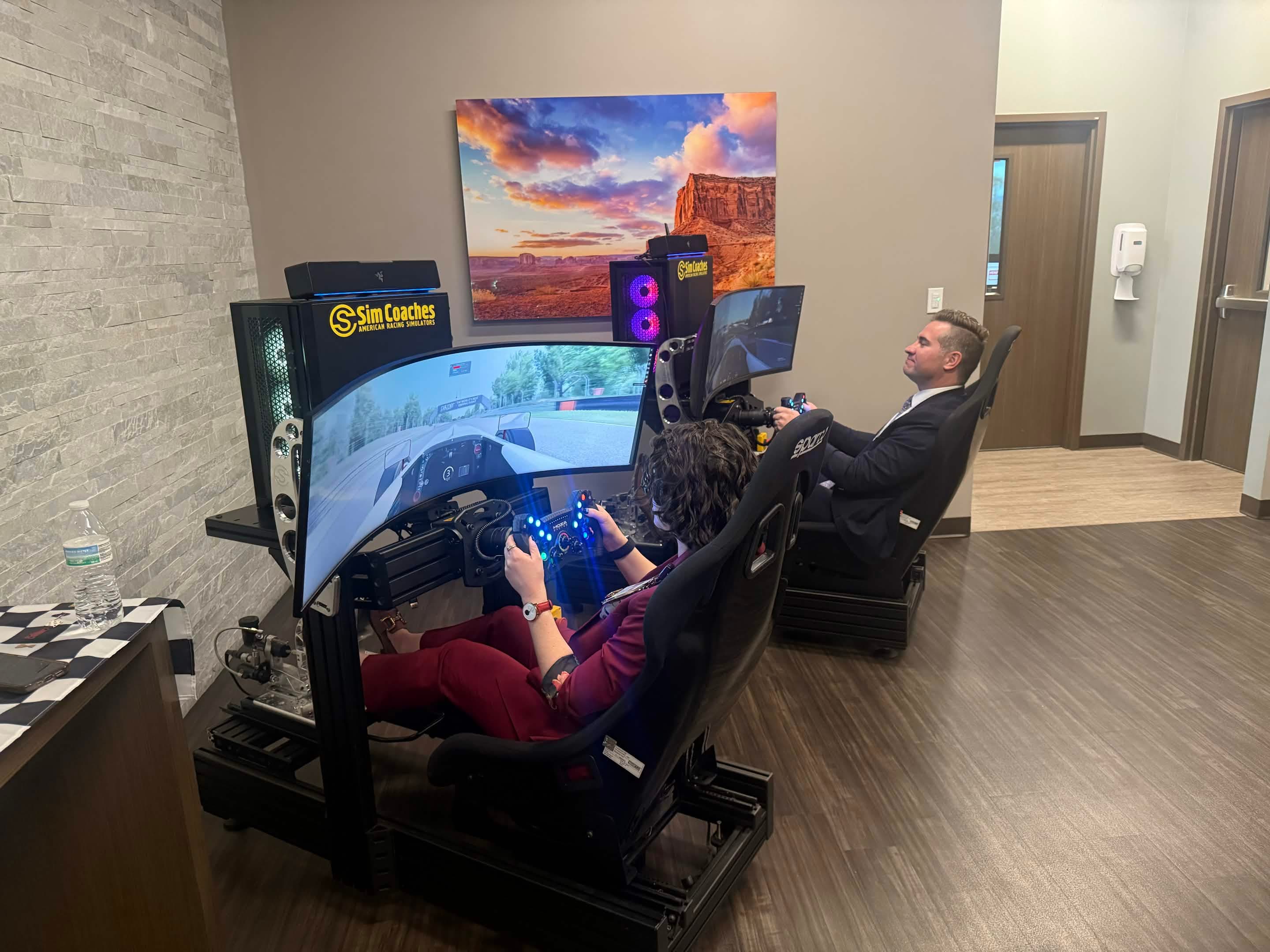 Dual racing simulator activation in a real event environment